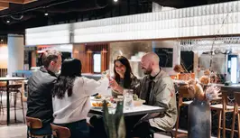 A group of friends dining in Hafnartorg in Reykjavík