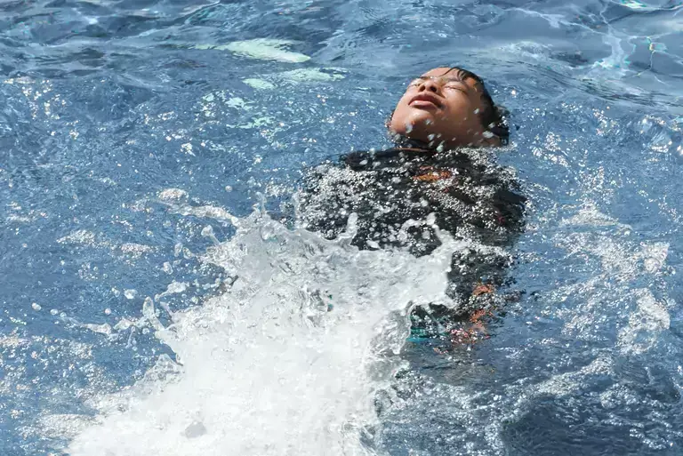 A boy swimming 