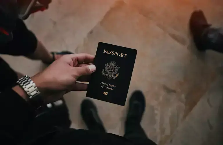 A man holding a passport