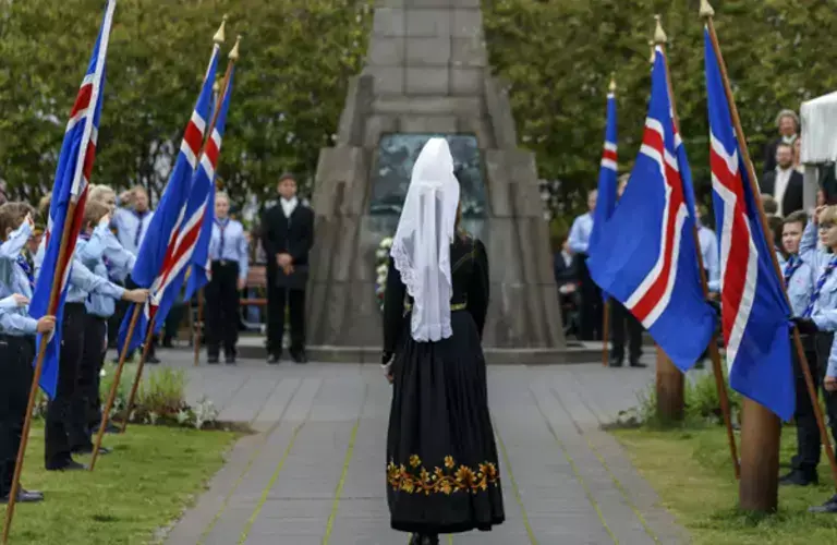 Woman in the Icelandic national costume walking